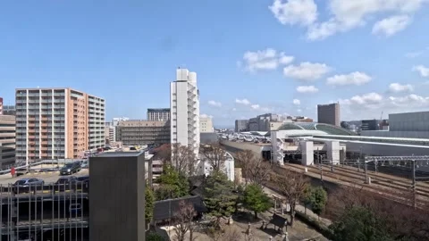 Cityscape view with train passing by on railway tracks near modern building.. Vídeo Stock 333093758