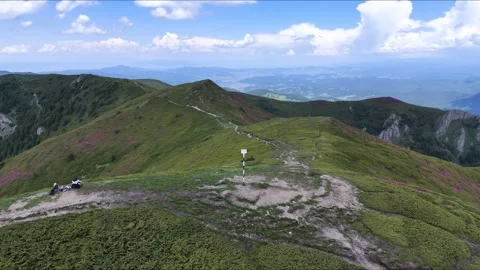 Ciucas Mountains ridge aerial view with trail marker in Romania Stock Footage 337110677