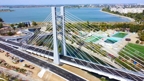 Ciurel passage, bridge over a river with moving cars, construction works, field Stock Footage 145156019