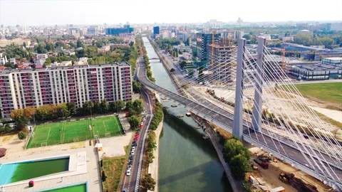 Ciurel passage, bridge over a river with moving cars, recreational complex, Stock Footage 145156756