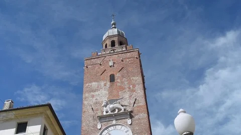 Civic tower with clock and statue of the Lion of Saint Mark Stock Footage 78028922