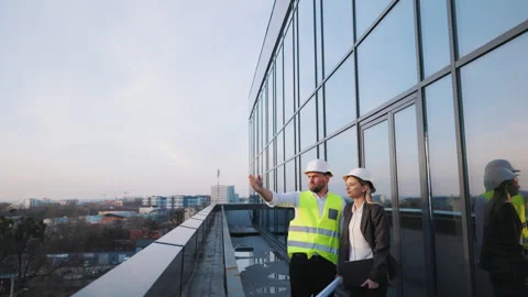 Civil engineer and architect manager are inspecting construction site assessing Stock Footage 245728084