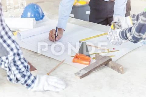 Civil engineer and foreman meeting and working on blueprint. Architects workp Stock Photos