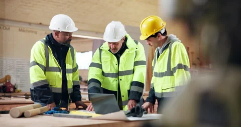 Civil engineer, blueprint and men with laptop in building, talk or renovation Stock Footage 338049102
