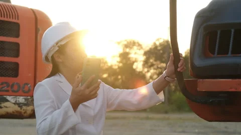 Civil engineer checking after work on construction site during sunset Stock Footage 229707281