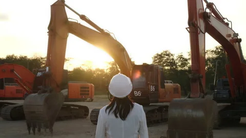 Civil engineer checking after work on construction site during sunset Stock Footage 229707311