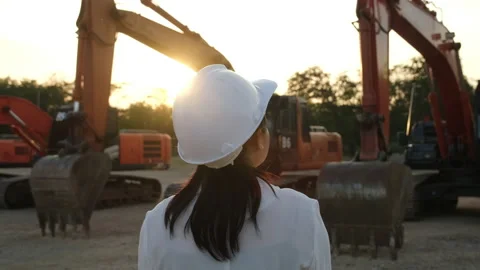 Civil engineer checking after work on construction site during sunset Stock Footage 229708880
