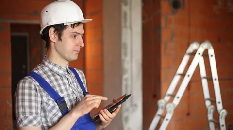 A civil engineer conducts economic calculations on the tablet Video stock 61582853
