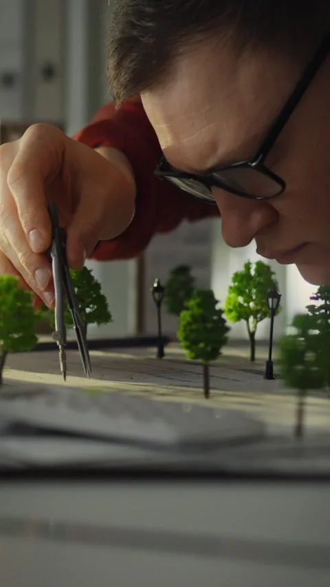 Civil engineer focusing on model development in an urban planning studio Stock Footage 331537770