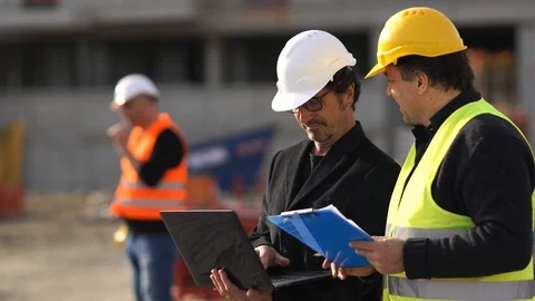 Civil engineer giving instructions to construction workers Stock Footage 87071316