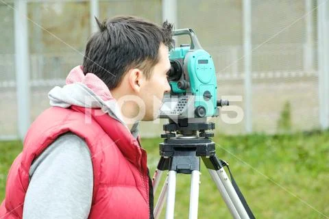 Civil engineer land survey with tacheometer or theodolite equipment. Stock Photos