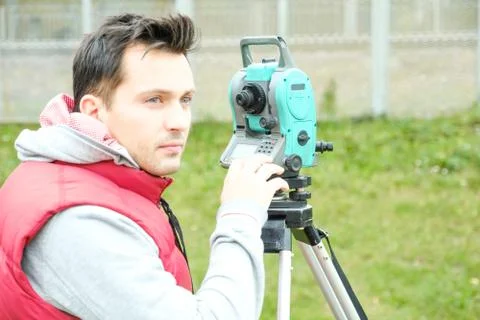 Civil engineer land survey with tacheometer or theodolite equipment. Stock Photos