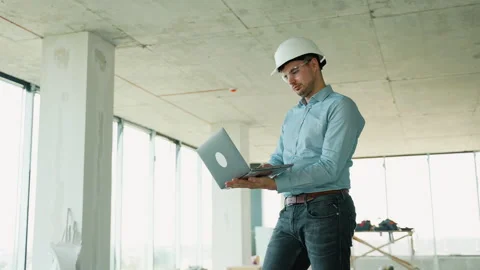 Civil Engineer with a laptop in construction site Stock Footage 285672517
