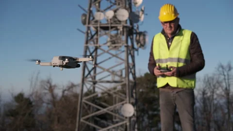 Civil engineer operating a drone with remote control at the construction site Stock-Footage 170794125