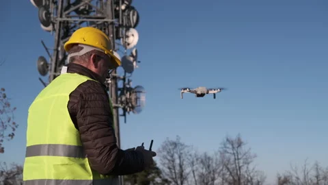 Civil engineer operating a drone with remote control at the construction site Video stock 170821926