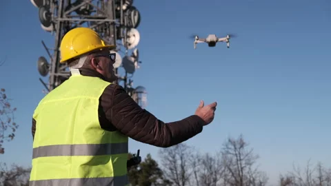 Civil engineer operating a drone with remote control lands the drone at his hand Stock-Footage 170828843