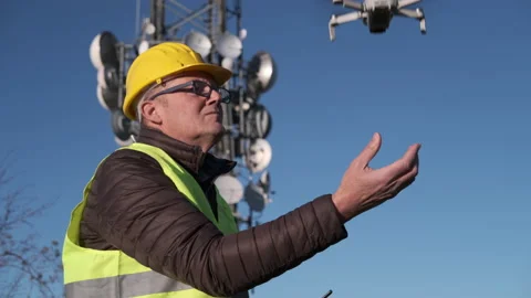 Civil engineer operating a drone with remote control lands the drone at his hand Stock-Footage 170830866