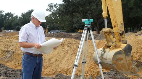 Civil Engineer Reading Blueprints Stock Footage 904671