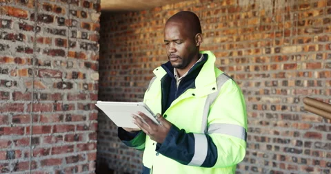 Civil engineer, scroll and man with tablet in construction site, real estate or Stock Footage 336778985