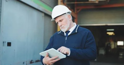 Civil engineer, scroll and man with tablet on construction site, online or 写真素材