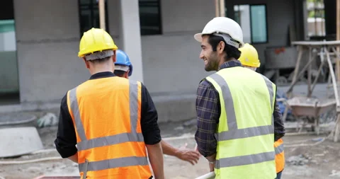 Civil engineer shakes hands then walks into the house Stock Footage 195616008