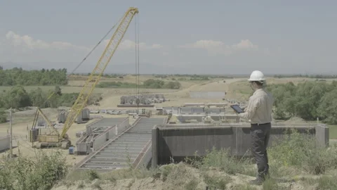 Civil Engineer Using Tablet Updates Data Then Turns And Smiles At Camera Ov.. Stock Footage 337708440