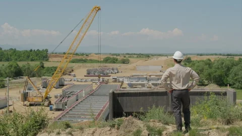 Civil Engineer in White Hard Hat Supervising Highway Viaduct Construction S.. Stock Footage 337706677