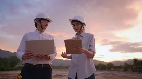 Civil engineer workers happy cheerfully talking together on rough empty plot Stock Footage 157066772