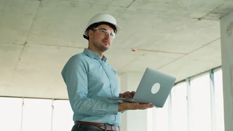 Civil engineer working on-site using digital tools Stock Footage 285672945