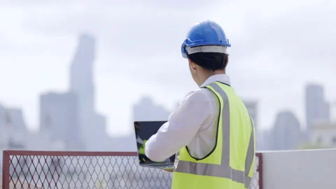 Civil engineering asian inspect building area In construction. Using laptop  Stock Footage 150047641