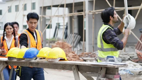 Civil engineers prepares to work with team Stock Footage 196688071