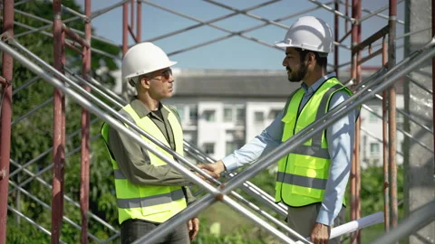 Civil engineers shake hands while jointly inspecting construction work Stock-Footage 226811230