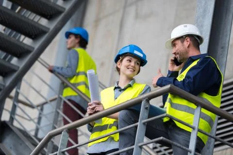 Civil engineers talking about project Stock Photos