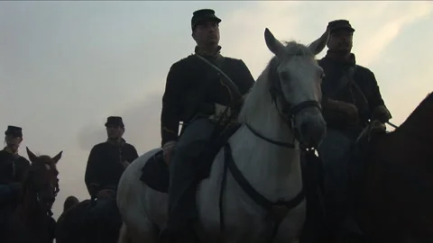 Civil War Union Cavalry Troopers on horseback ride into battle Stock Footage 137755553