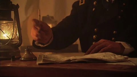 Civil War Union General writes in tent by lamplight Stock Footage 81536475