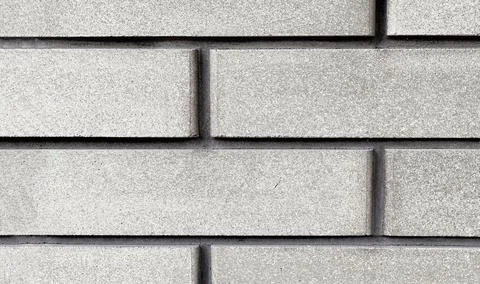 Cladding brick texture close-up. Exterior decoration of walls and foundations of Stock Photos