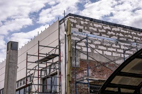 Cladding facades with decorative panels. Building house Photos