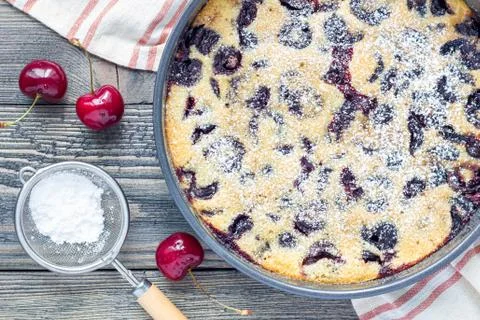 Clafoutis with cherry in baking dish, horizontal, top view 스톡 사진