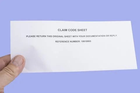 Claim code sheet on a pink background 스톡 사진