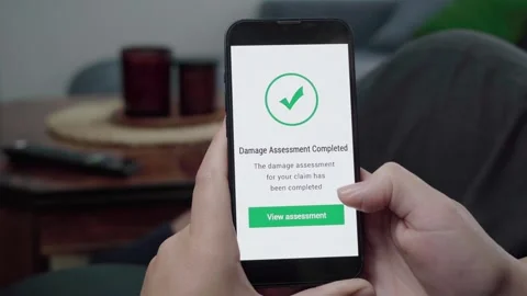 Claim Damage Assessment Completed Confirmation on Insurance App Stock Footage 343973814