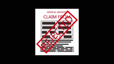 Claim form receives a red rejected stamp overlay. This claim form signals a.. Stock Footage 337621671