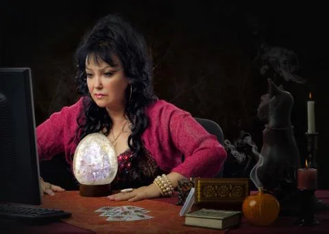 Clairvoyant using big crystal egg for scrying online Stock Photos