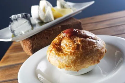 Clam chowder served inside a crispy bread. Stock Photos