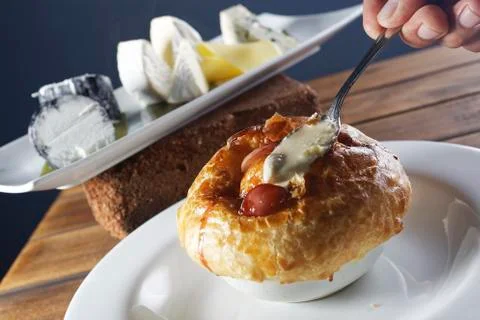 Clam chowder served inside a crispy bread. Stock Photos