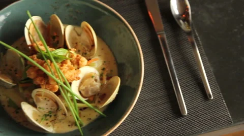 Clam dinner with sauce, close up, pan left and right Stock Footage 44617277