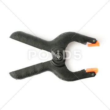 Clamp with orange plastic jaws, isolated over the white background Stock Photos
