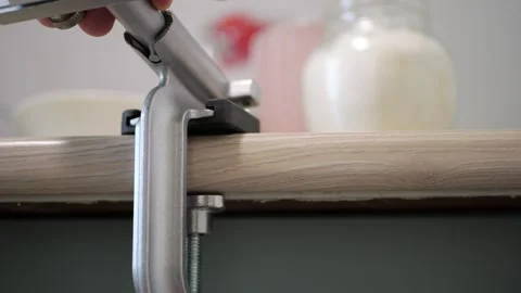 Clamping C-clamp securing countertop rotating metal sound hand motion precision Video stock 320896648