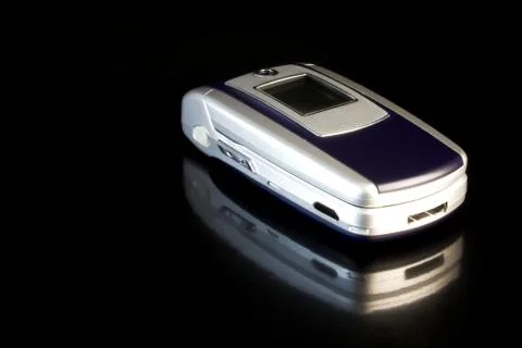 Clamshell Mobile Phone on black background Stock Photos
