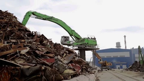 Clamshells unloading sctrap metal infront of the plant medium shot Stock Footage 72715518