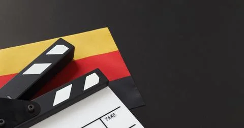 Clapper board and german flag on black background Stock Photos